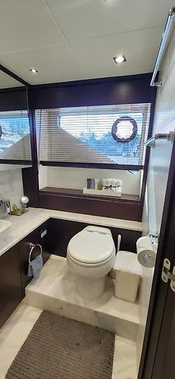  Yacht Photos Pics Luxurious bathroom in 2020 Sunseeker Predator 74 XPS yacht, featuring modern fixtures and elegant design.