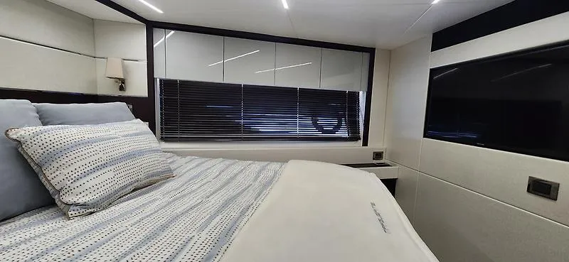  Yacht Photos Pics Luxurious bedroom interior of 2020 Sunseeker Predator 74 XPS yacht with modern design.