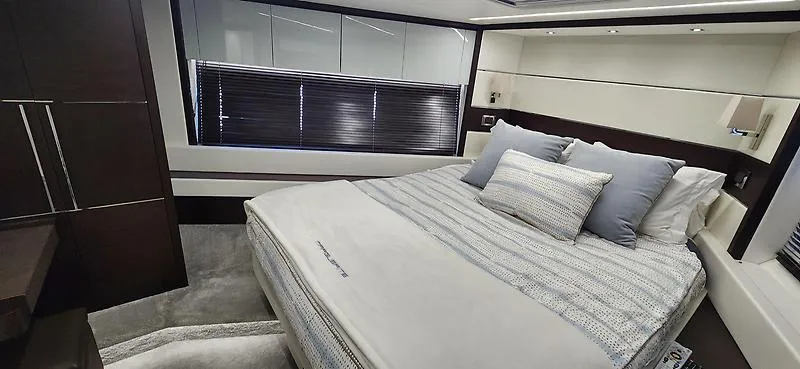  Yacht Photos Pics Luxurious bedroom interior of 2020 Sunseeker Predator 74 XPS yacht with modern design.