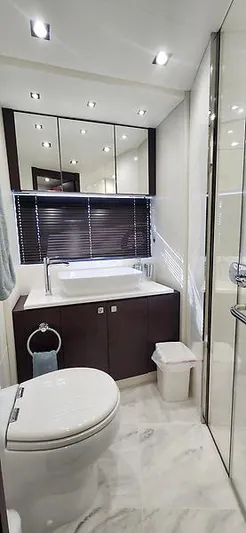  Yacht Photos Pics Luxurious bathroom in 2020 Sunseeker Predator 74 XPS yacht with modern fixtures and elegant design.