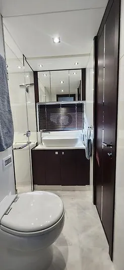  Yacht Photos Pics Luxurious bathroom in 2020 Sunseeker Predator 74 XPS yacht, featuring modern fixtures and elegant design.