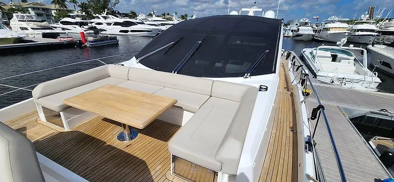  Yacht Photos Pics Luxury Sunseeker Predator 74 XPS yacht, 2020 model, docked with elegant seating and table.