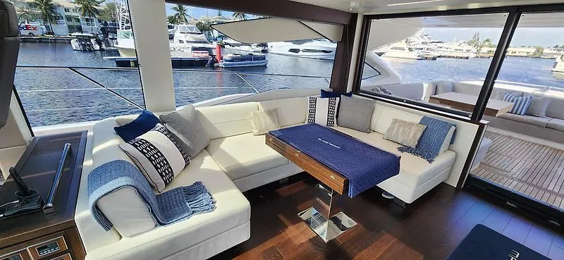  Yacht Photos Pics Luxurious interior of 2020 Sunseeker Predator 74 XPS yacht with elegant seating and waterfront view.