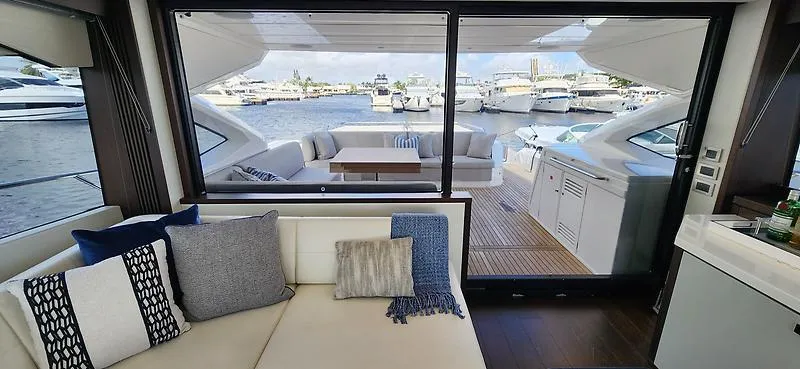  Yacht Photos Pics Luxurious interior of 2020 Sunseeker Predator 74 XPS yacht with marina view.