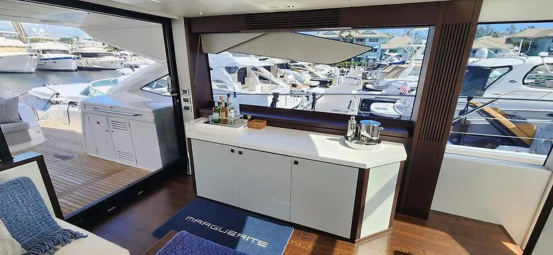  Yacht Photos Pics Luxurious interior of 2020 Sunseeker Predator 74 XPS yacht with marina view.