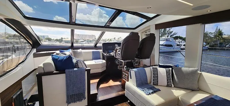  Yacht Photos Pics Luxurious interior of 2020 Sunseeker Predator 74 XPS yacht with panoramic windows and plush seating.