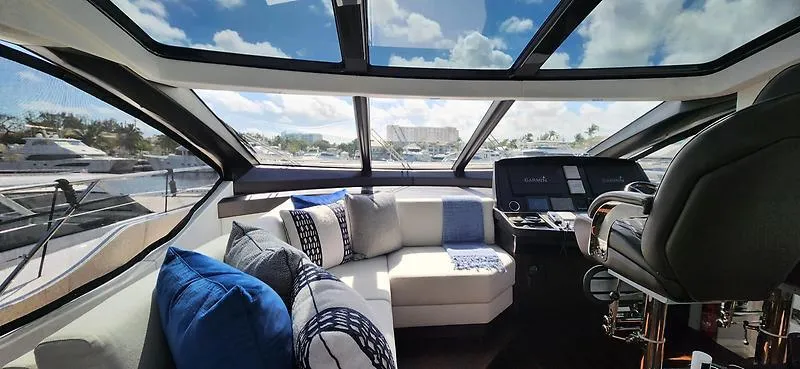  Yacht Photos Pics Luxurious interior of 2020 Sunseeker Predator 74 XPS yacht with plush seating and panoramic windows.