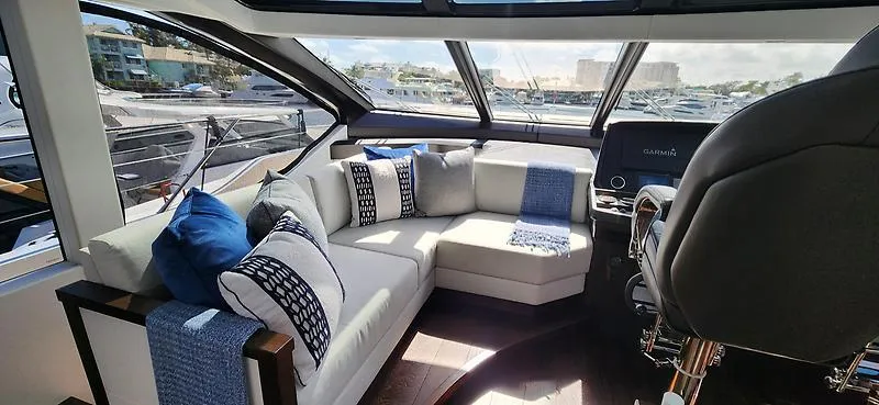  Yacht Photos Pics Luxurious interior of 2020 Sunseeker Predator 74 XPS yacht with plush seating and modern design.