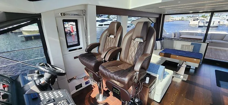  Yacht Photos Pics Luxurious interior of 2020 Sunseeker Predator 74 XPS yacht with leather seating and modern design.