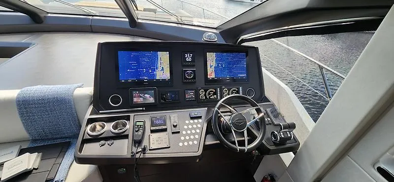  Yacht Photos Pics Helm of 2020 Sunseeker Predator 74 XPS yacht with advanced navigation displays.