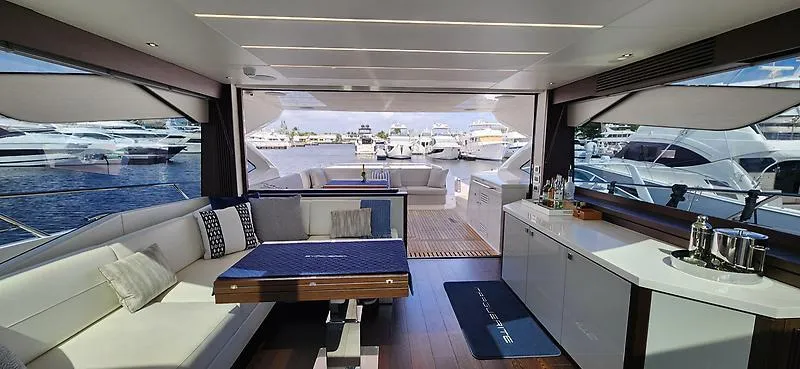  Yacht Photos Pics Luxurious interior of 2020 Sunseeker Predator 74 XPS yacht, featuring elegant seating and modern amenities.