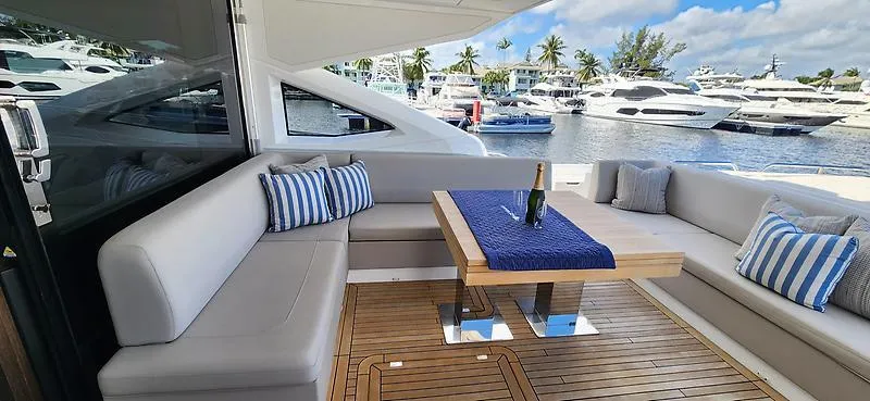  Yacht Photos Pics Luxurious Sunseeker Predator 74 XPS yacht interior with elegant seating and marina view.