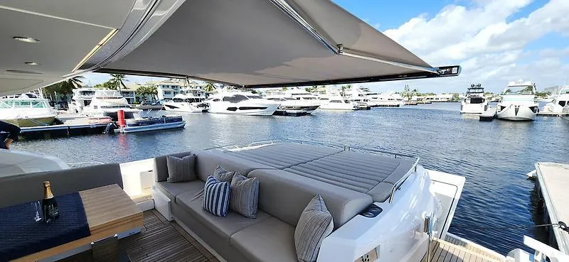  Yacht Photos Pics Luxurious Sunseeker Predator 74 XPS yacht with spacious deck, docked at marina, 2020 model.