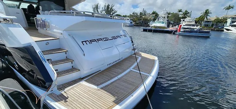  Yacht Photos Pics 2020 Sunseeker Predator 74 XPS yacht docked, featuring sleek design and spacious deck.