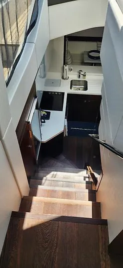  Yacht Photos Pics Staircase leading to modern kitchen in 2020 Sunseeker Predator 74 XPS yacht.