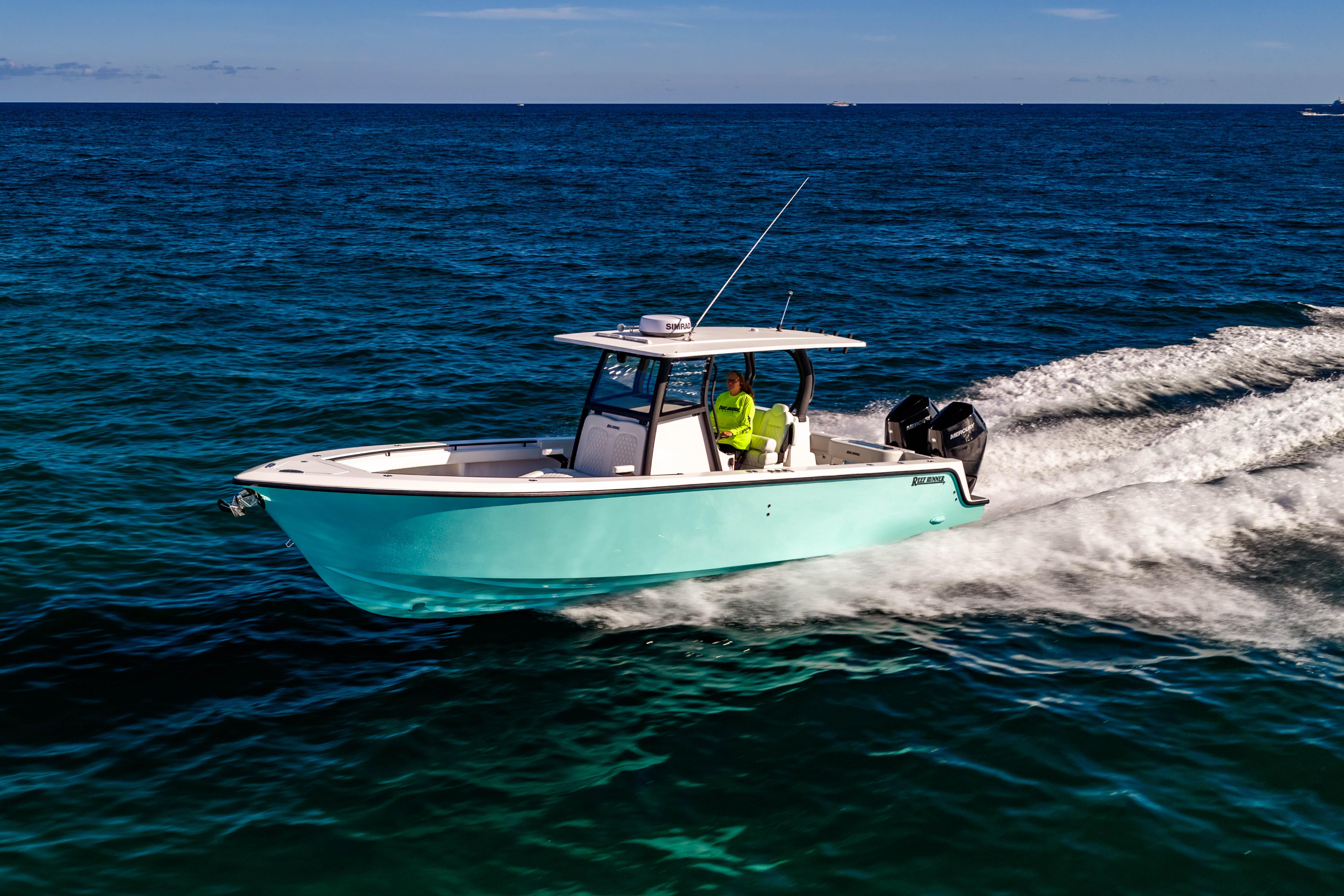 2026 Reef Runner 340 boat cruising on open ocean waters.
