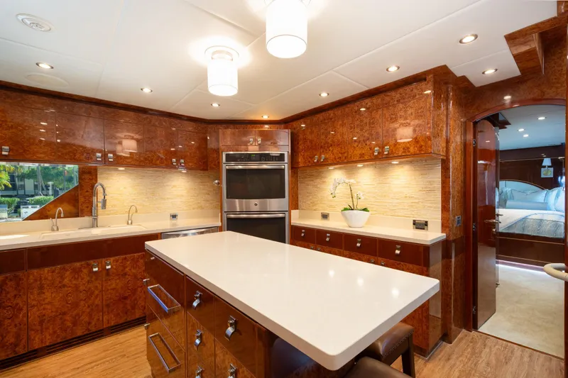 Lucky Penny Yacht Photos Pics Luxurious kitchen interior of 2014 Hargrave Sky Lounge yacht with modern amenities and elegant design.