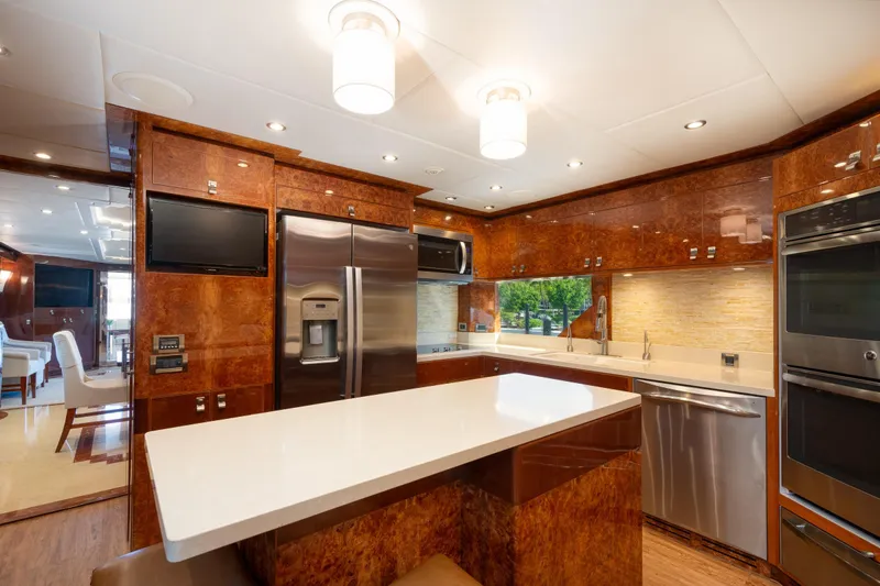 Lucky Penny Yacht Photos Pics Luxurious kitchen in 2014 Hargrave Sky Lounge yacht with modern appliances and elegant wood finishes.