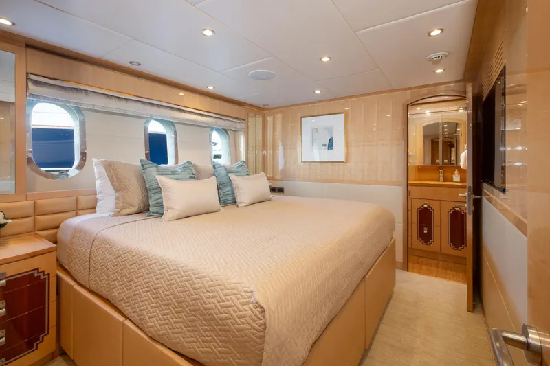 Lucky Penny Yacht Photos Pics Luxurious bedroom interior of 2014 Hargrave Sky Lounge yacht with elegant decor and soft lighting.