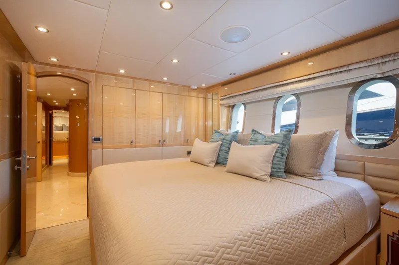Lucky Penny Yacht Photos Pics Luxurious bedroom interior of 2014 Hargrave Sky Lounge yacht with elegant decor and large windows.