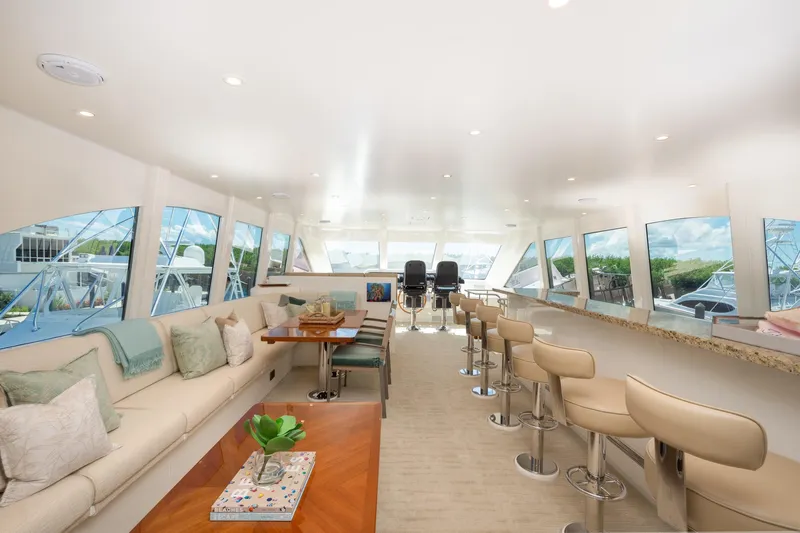 Lucky Penny Yacht Photos Pics Luxurious interior of 2014 Hargrave Sky Lounge yacht with elegant seating and panoramic windows.