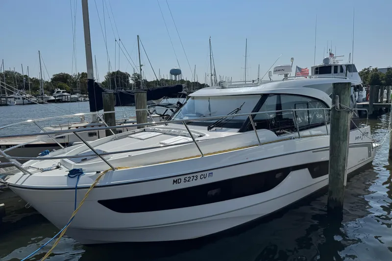  Yacht Photos Pics 2024 Beneteau Antares 11 docked at marina, sleek design, sunny day.