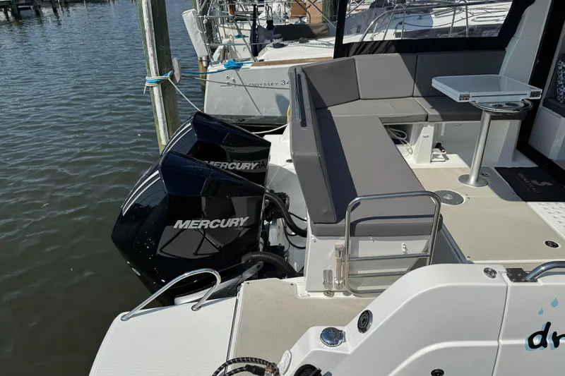  Yacht Photos Pics 2024 Beneteau Antares 11 with Mercury outboard engines, featuring a spacious seating area.