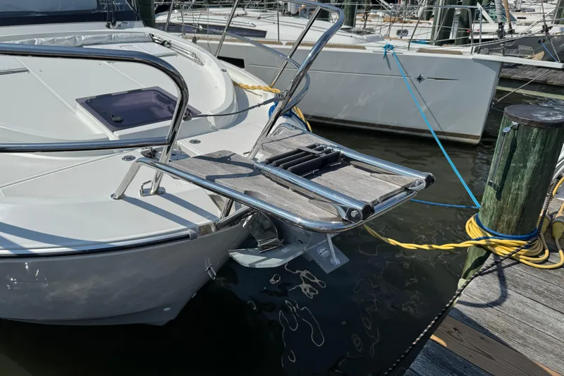 Yacht Photos Pics 2024 Beneteau Antares 11 docked, featuring a sleek bow and stainless steel fittings.