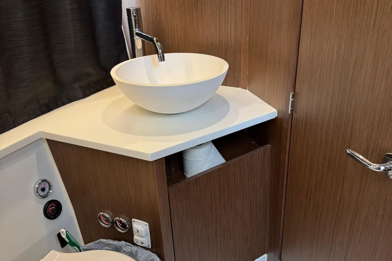  Yacht Photos Pics Modern bathroom sink in 2024 Beneteau Antares 11 yacht interior.