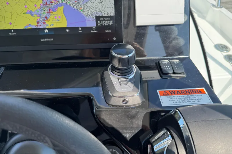  Yacht Photos Pics Control panel of 2024 Beneteau Antares 11 with Garmin navigation and joystick controls.