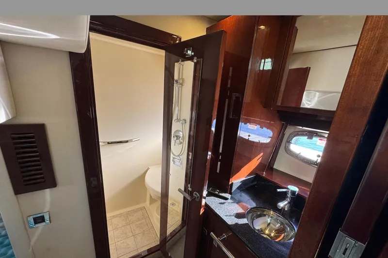 Land Escape Yacht Photos Pics Interior of 2010 Sea Ray 470 Sundancer yacht bathroom with sink and shower.