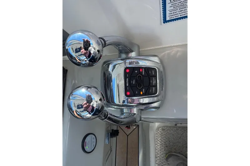 Land Escape Yacht Photos Pics Control panel of a 2010 Sea Ray 470 Sundancer boat with chrome throttle levers.
