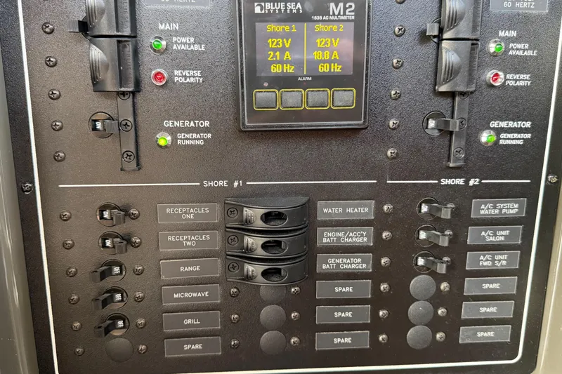 Mj Yacht Photos Pics Electrical panel of a 2019 Carver C34 boat, featuring generator and shore power controls.
