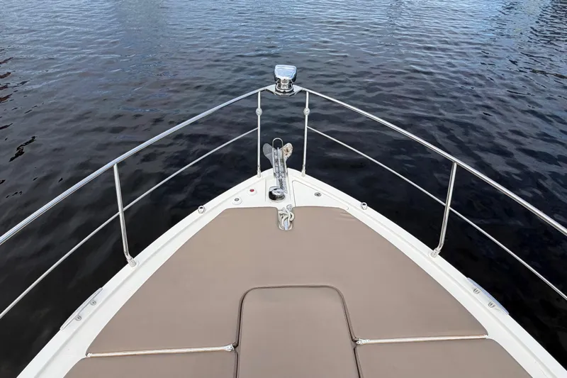 Mj Yacht Photos Pics Bow view of 2019 Carver C34 yacht on calm water.