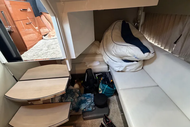 Mj Yacht Photos Pics 2019 Carver C34 interior cabin with storage, seating, and bedding.