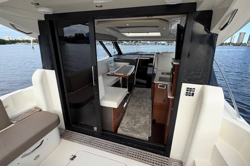 Mj Yacht Photos Pics 2019 Carver C34 yacht interior with seating, table, and water view.