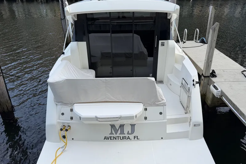 Mj Yacht Photos Pics 2019 Carver C34 yacht docked in Aventura, FL, rear view with covered seating.