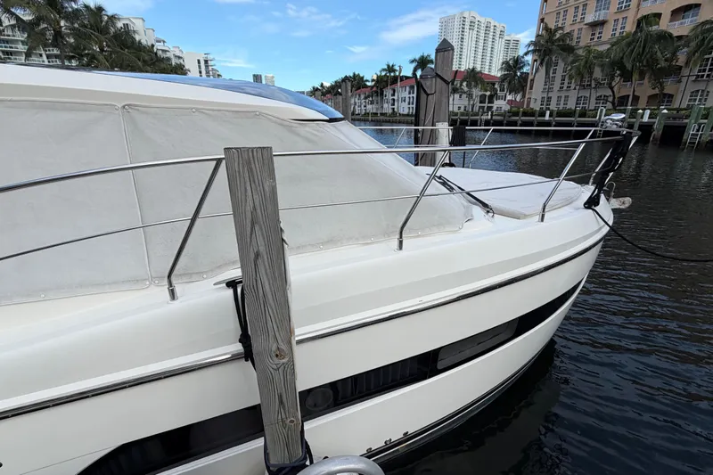 Mj Yacht Photos Pics 2019 Carver C34 yacht docked in a scenic waterfront location.