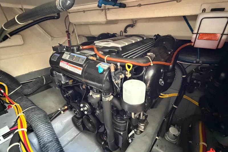 Mj Yacht Photos Pics Engine compartment of a 2019 Carver C34 boat, showcasing detailed mechanical components.