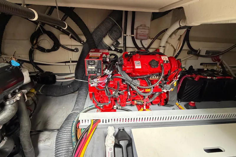 Mj Yacht Photos Pics Engine room of 2019 Carver C34 with red EFI engine and wiring.