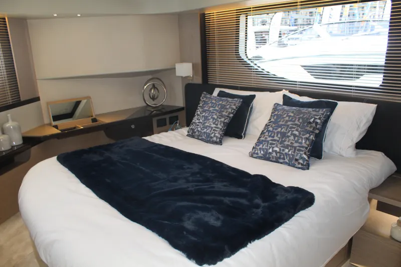 In Stock Yacht Photos Pics Luxurious bedroom interior of 2025 Absolute 47 Fly yacht with elegant bedding and modern decor.