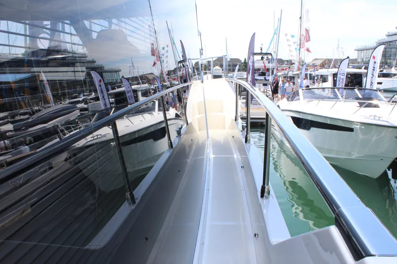 In Stock Yacht Photos Pics 2025 Absolute 47 Fly yacht at marina, showcasing sleek design and modern features.