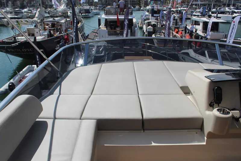 In Stock Yacht Photos Pics Luxurious 2025 Absolute 47 Fly yacht at marina, featuring spacious sunbathing deck.