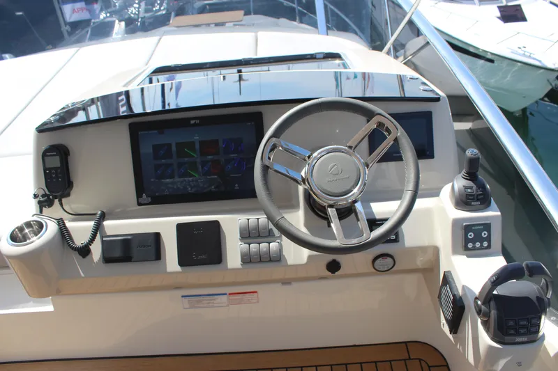 In Stock Yacht Photos Pics 2025 Absolute 47 Fly yacht helm with modern controls and navigation display.