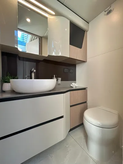 In Stock Yacht Photos Pics Modern bathroom in 2025 Absolute 47 Fly yacht with sleek fixtures and elegant design.