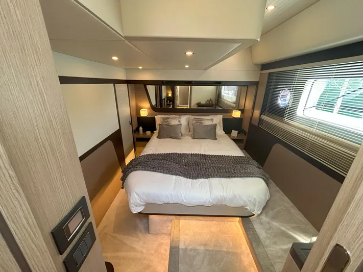 In Stock Yacht Photos Pics Luxurious bedroom interior of 2025 Absolute 47 Fly yacht, featuring modern design and cozy ambiance.