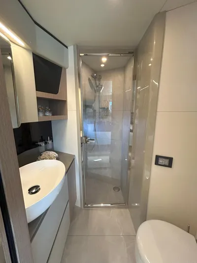 In Stock Yacht Photos Pics Luxurious bathroom in 2025 Absolute 47 Fly yacht with modern fixtures and shower.