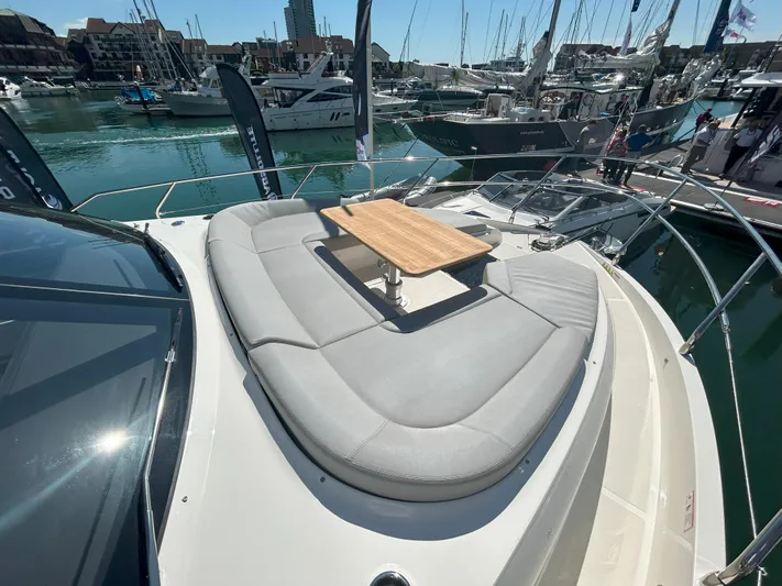 In Stock Yacht Photos Pics Luxury Absolute 47 Fly yacht with sunbathing area and table, docked in marina, 2025 model.