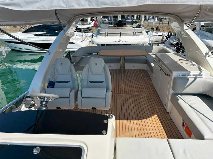 In Stock Yacht Photos Pics 2025 Absolute 47 Fly yacht interior with sleek seating and modern design.