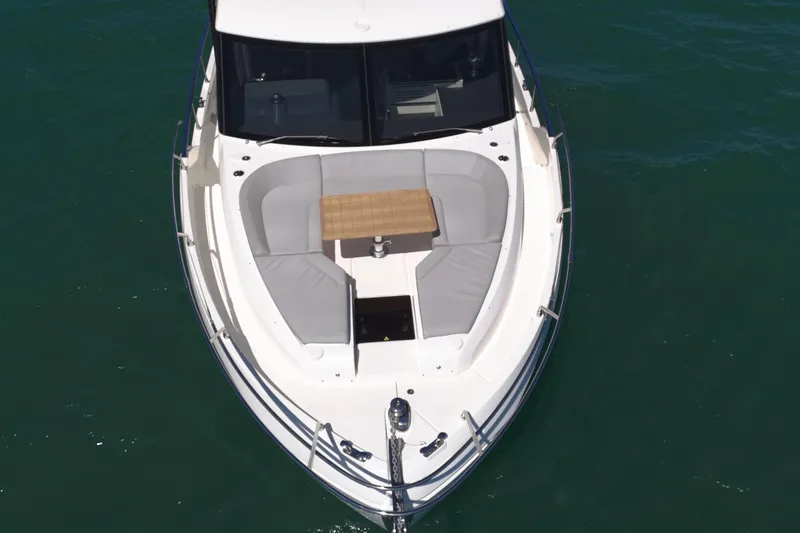 In Stock Yacht Photos Pics 2025 Absolute 47 Fly yacht with spacious deck seating and table on calm water.